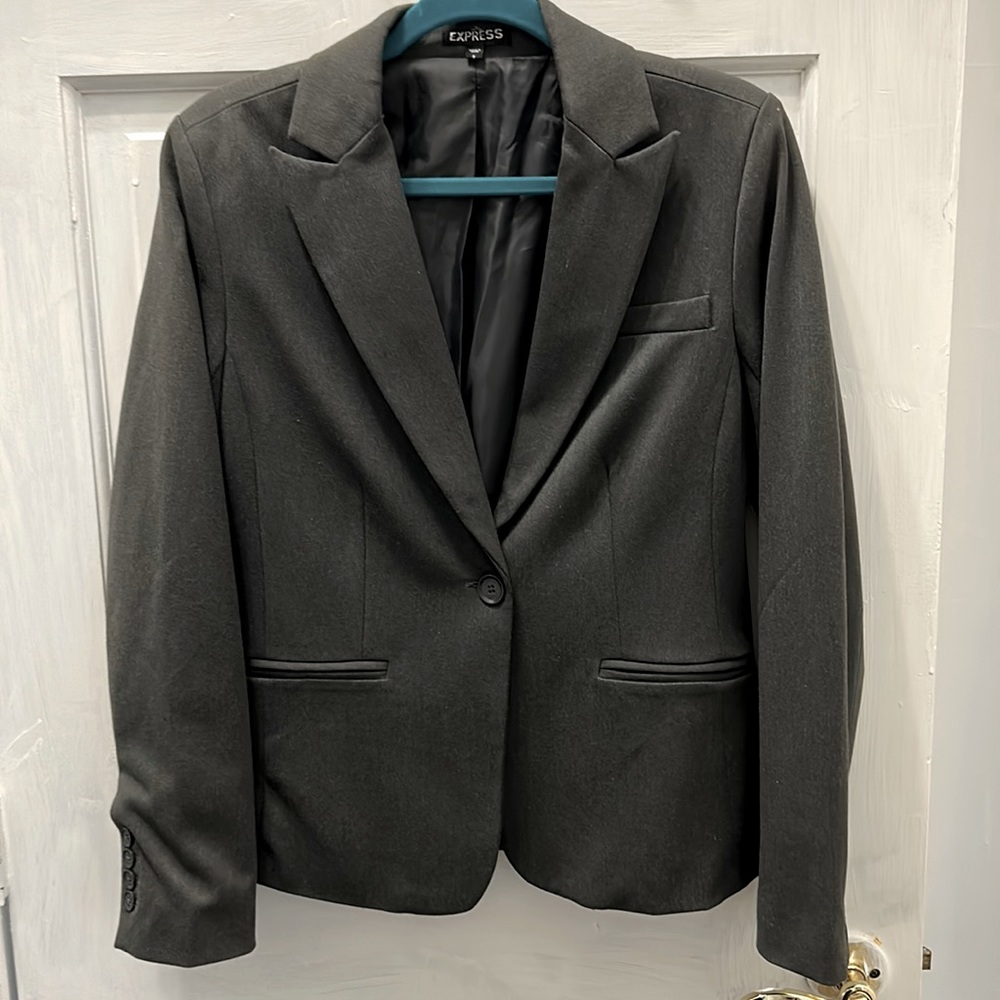 Grey office jacket! Never worn. Has a bit of stretch to it! Lined .